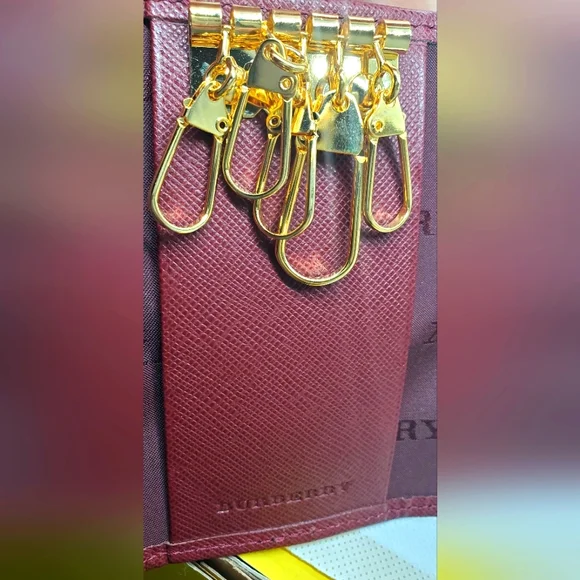 BURBERRY- Burgundy Key Holder with Gold Accents -Like-New -